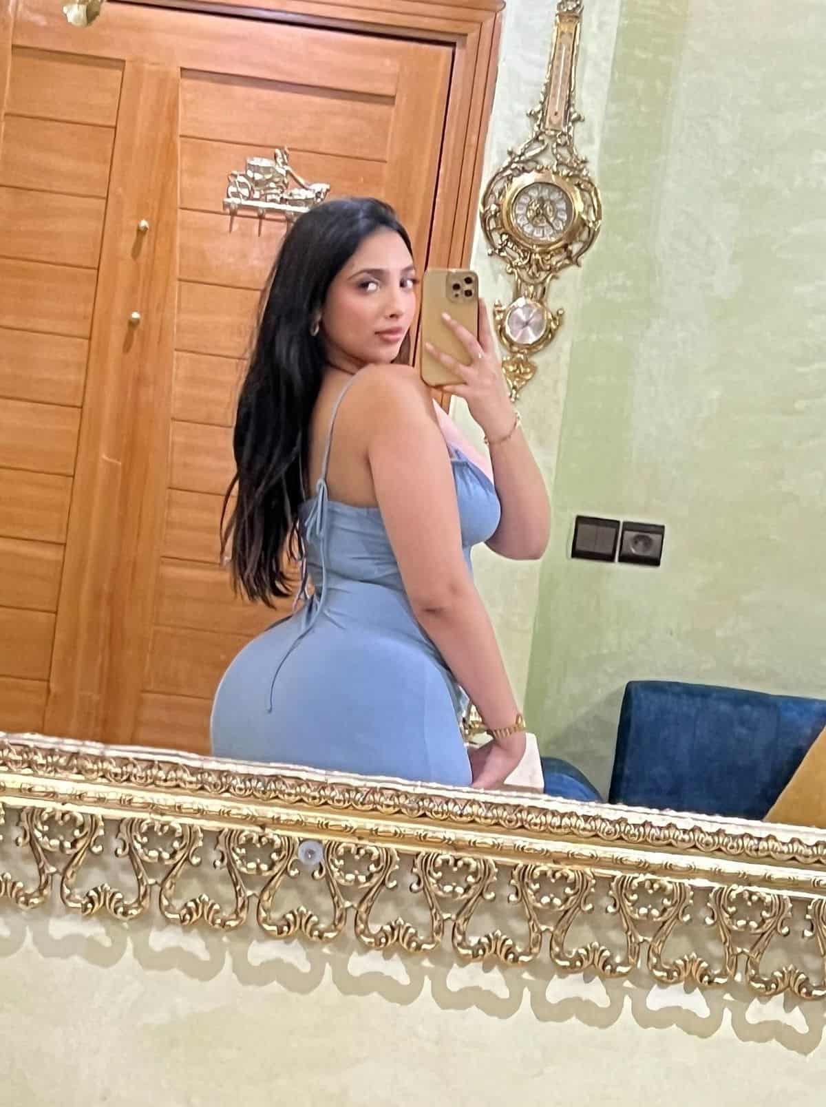 Exotic European call girl in hotel lounge waiting for elite client